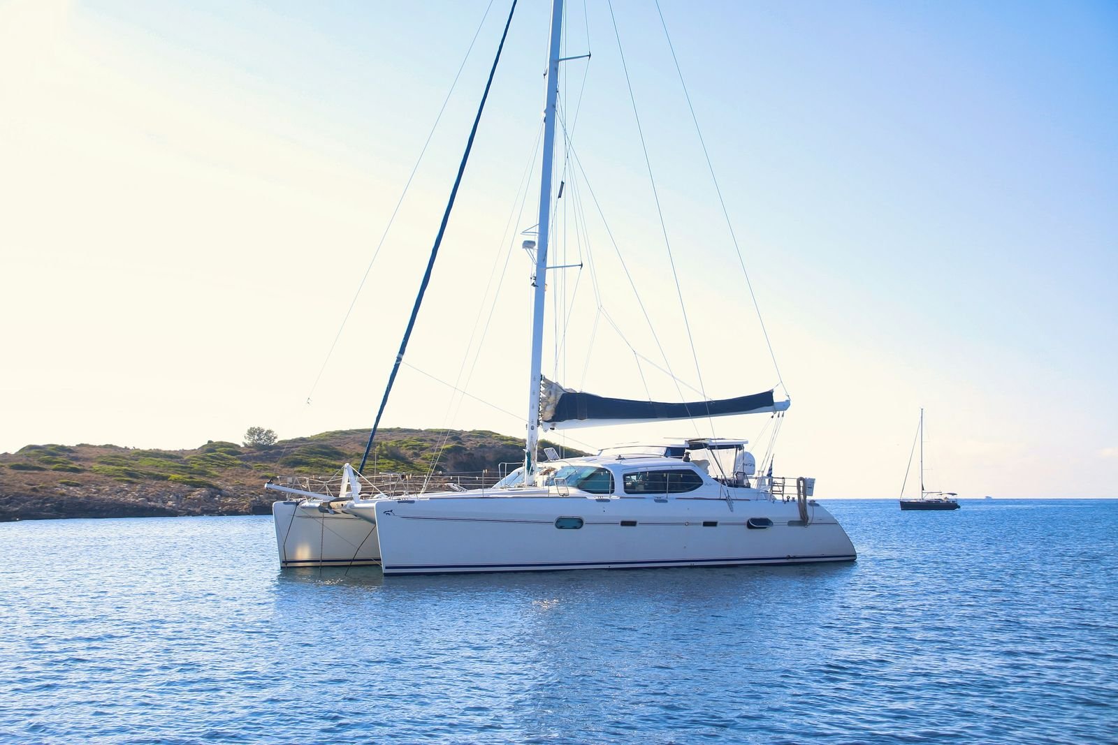A catamaran at anchor off Palma de Mallorca